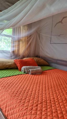 a bed inside of a tent with a mattress at Hotel Viejamar con Cocina compartida in Puerto López