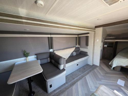 a small room with a couch and a bed at Catchin Rays in North Topsail Beach