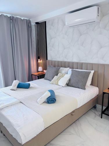 a bedroom with two beds with towels on them at Blue Ocean Costa Adeje 502 in Playa de las Americas