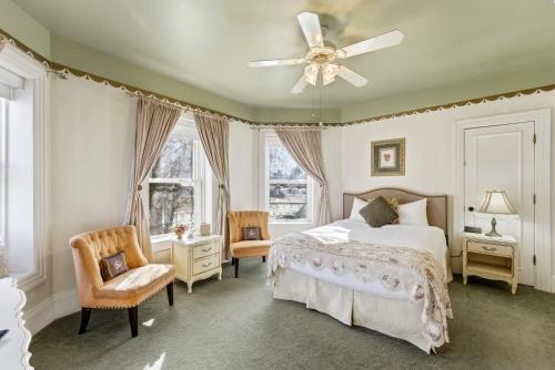 a bedroom with a bed and a ceiling fan at Heber Senator Bed and Breakfast in Heber City