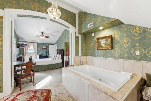 a bathroom with a tub and a bedroom at Heber Senator Bed and Breakfast in Heber City