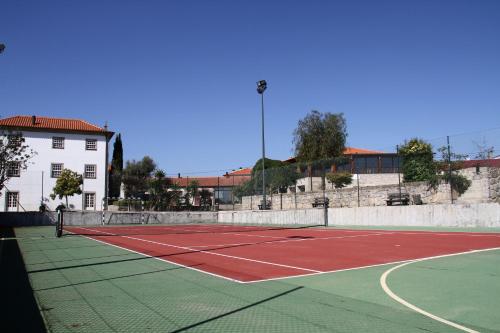 a tennis court with a tennis ball on it at Hotel Rural Quinta de Sao Sebastiao in Barroselas