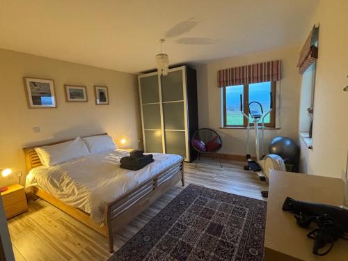 a bedroom with a bed and a camera in it at Skellig Sanctuary in Dingle