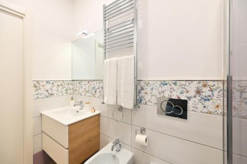 a bathroom with a sink and a mirror at Lucia Appartamenti in Ischia Town