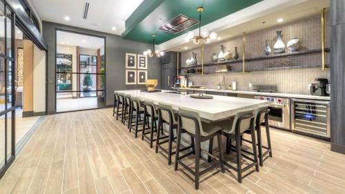 a large kitchen with a large table and chairs at 1200sf 2bed 2bath Apt near Medical City, Toyota Stadium and The Ford Center in Frisco