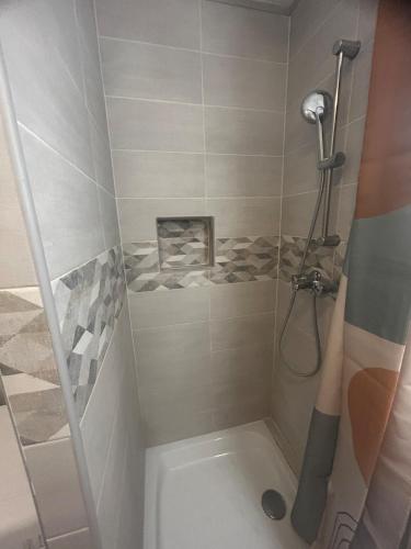 a bathroom with a shower and a toilet at apartment with balcony in Ronchin