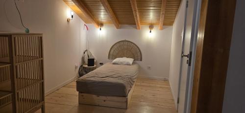 a small bedroom with a bed in a room at Casa da Picoteira - Pool - Pets - EV Charger in Proença-a-Nova