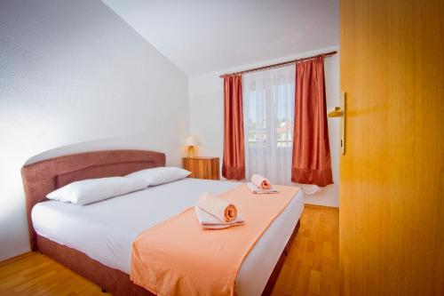 Postel nebo postele na pokoji v ubytování Apartment Mara