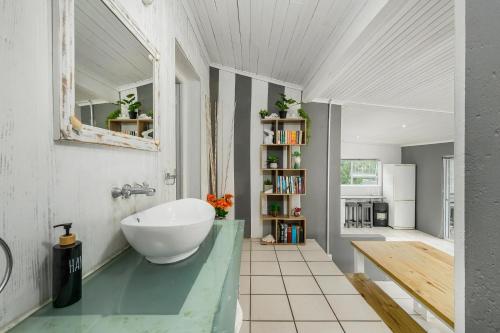 a bathroom with a large white bowl sink on a counter at 302 On Old Sea View Road Chelsea in Port Elizabeth