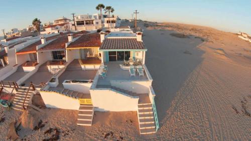 an aerial view of a house on the beach at Cozy & Colorful Beachfront Condo Las Olas I 28 in Puerto Peñasco