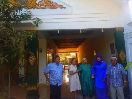 a group of people standing outside of a building at Rumah Desa Homestay in Prambanan