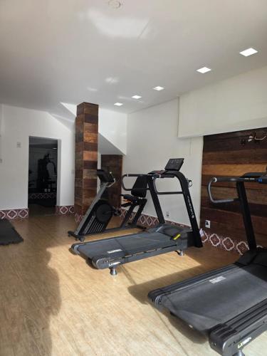 a gym with two exercise bikes in a room at Hotel Estilo de Minas in Diamantina