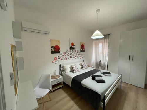 a bedroom with a bed and a table and a chair at Arkem's home in Norma