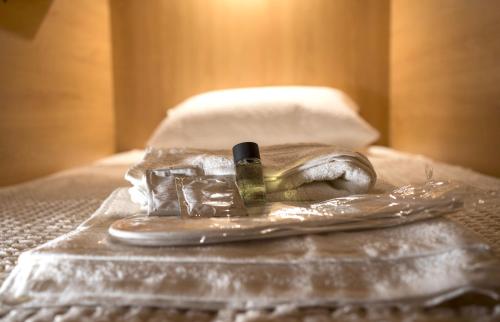 a pair of shoes wrapped in plastic on a bed at Chania Capsule Stay in Chania