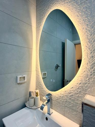 a bathroom with a sink and a mirror at Pure Sense in Beʼer Ora