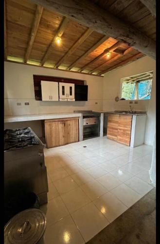 a kitchen with a stove and a counter top at Casa Aurea in Medellín