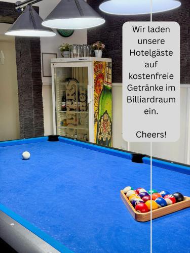 a room with a pool table and balls on it at Hotel Rühen, 24 Stunden Check in, Küche, kostenfreie Parkplätze in Rühen