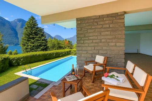a villa with a swimming pool in the mountains at Villa Marilyn in Nesso
