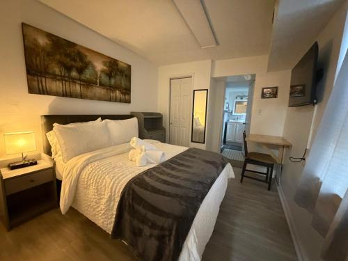 a bedroom with a bed with a towel on it at Discover Charm City from a Cozy Retreat in Baltimore