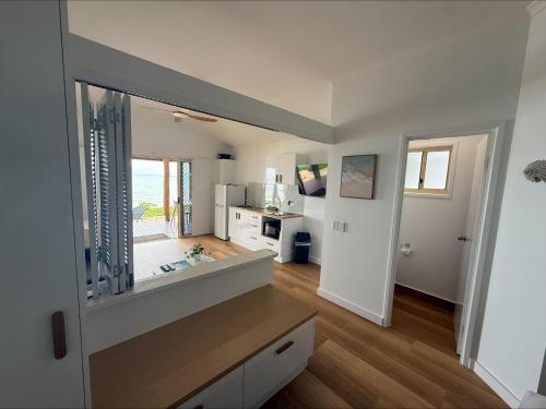 a kitchen with a large mirror in a room at Ellis Beach Oceanfront Holiday Park in Palm Cove