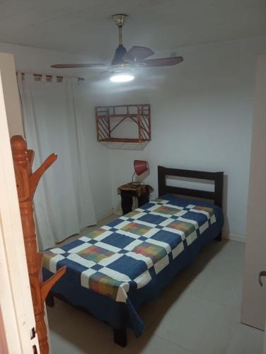 a bedroom with a bed and a ceiling fan at Espacio Armonia Junin Balneario in Junín