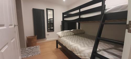 a bedroom with a bunk bed and a ladder at Apartment No 4 in Bridlington