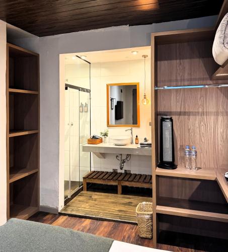 a bathroom with a shower and a sink at Hm Montes Central in Cusco