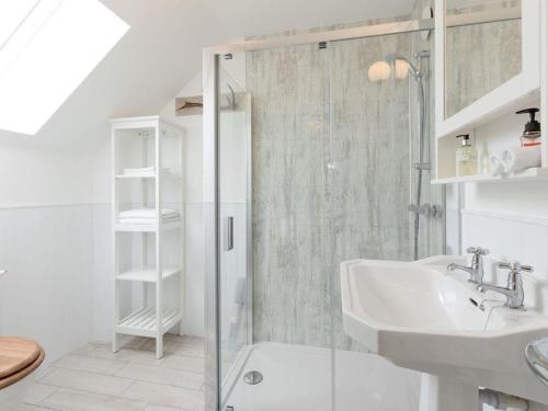 a bathroom with a shower and a sink at Millbank in Ballindalloch