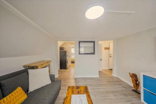 a living room with a couch and a table at Chic, Cozy & New Prime location with AC, Street Parking #4 in Renton