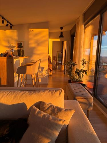 a living room with a couch and a table at Carsium View House in Hîrşova