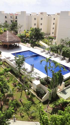 an overhead view of a pool at a resort at Comfortable 2BR Condo pool & gym in Tulum