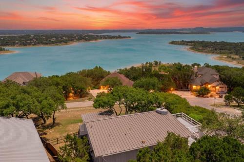 an aerial view of a house and a lake at Tequila Sunrise hot tub lake view firepit pool in Canyon Lake