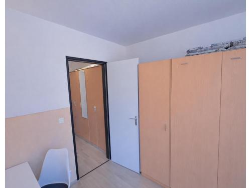 an empty room with a door and some cabinets at Studio Bernhard mit Pool und Sauna in Freyung
