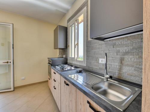 a kitchen with a sink and a counter top at Villa with private pool in Floridia in Floridia