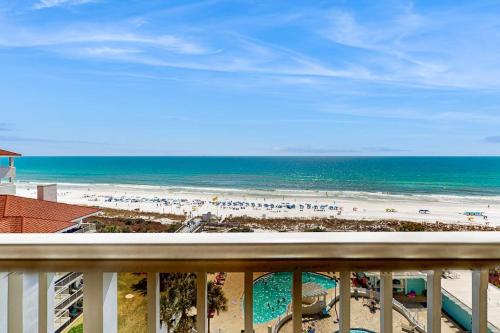 a view of the beach from the balcony of a resort at TOPS'L Tides 704 in Destin
