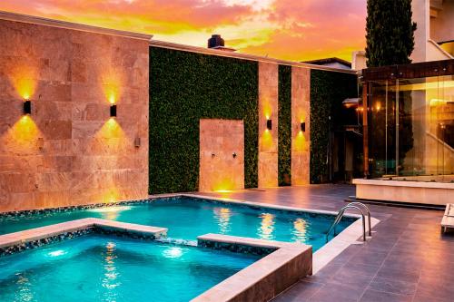 a swimming pool in the middle of a building at Hotel Ruinas Resort in Huehuetenango