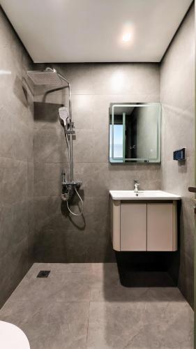 a bathroom with a sink and a mirror at 4Chan Phúc Đồng Apartment in Hanoi