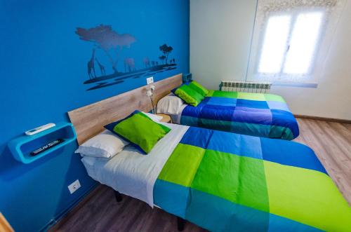 Ένα ή περισσότερα κρεβάτια σε δωμάτιο στο Hostal La Pastora