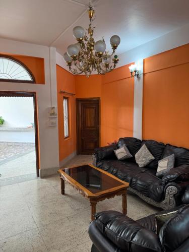 a living room with a couch and a coffee table at KmK Homestay in Rupa