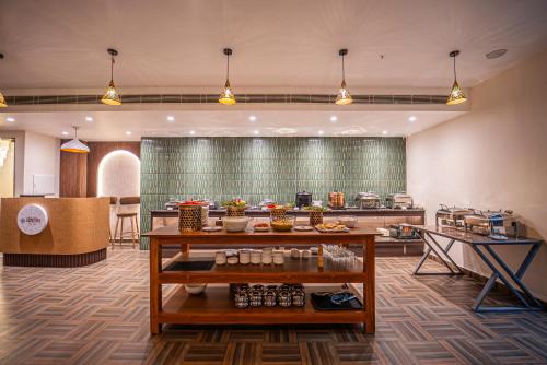 a lobby of a hotel with aasteryasteryasteryasteryasteryasteryasteryasteryastery at Mosaic Connect Ayodhya in Ayodhya