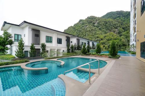 an image of a swimming pool in a building at Sunway Onsen Suite in Tambun