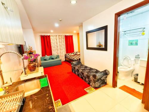 a large living room with a red carpet at 2B-03 Condo Staycation at Megatower 1 in Baguio