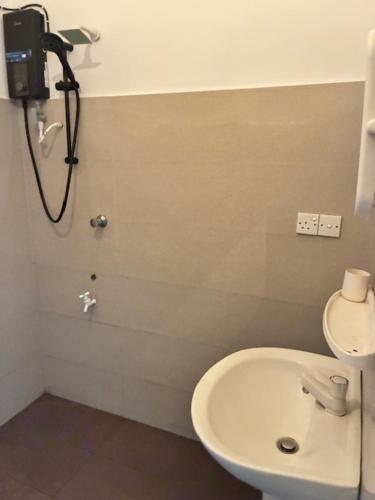 a bathroom with a toilet and a sink at Amani Rooms in Panadura