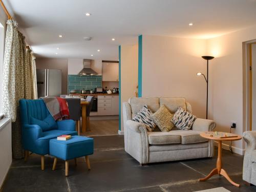 a living room with two chairs and a couch at Uk47757 - Rose Cottage in Launceston