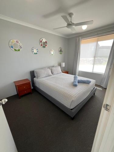 a bedroom with a bed and a window at Hibiscus Haven in Eaton