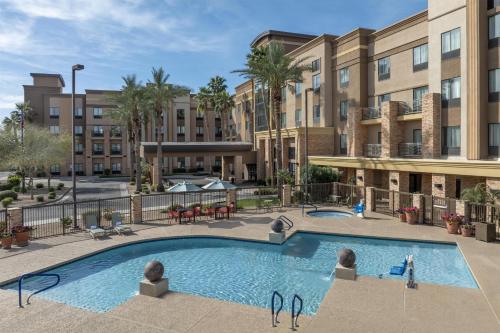 an image of a swimming pool at a hotel at Hampton Inn & Suites Phoenix Glendale-Westgate in Glendale