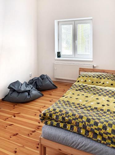 a bedroom with two bean bags on the floor at Apartment Kundratice in Košťálov
