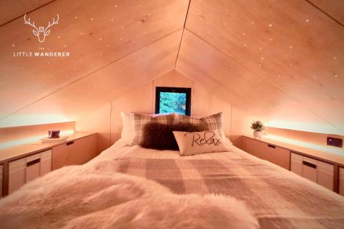 a bedroom with a bed in a small room at The Little Wanderer in Queenstown