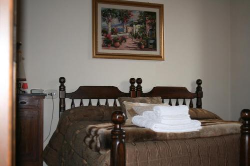 Relais Il Monticello tesisinde bir odada yatak veya yataklar
