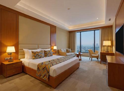 a hotel room with a bed and a television at Hotel Grand Loft Near IGI Airport New Delhi in Pilwa